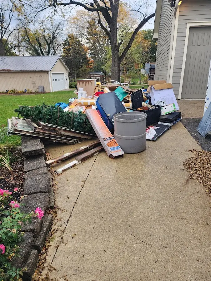 Dumpster being loaded with debris for Demolition Dumpster Rental in Forty Fort